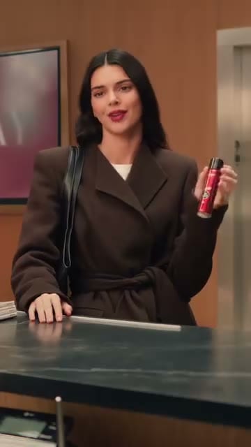 Sell Proposition, Hero product reveal, L'Oréal Infallible spray held at the desk. The claim and the product finally meet.