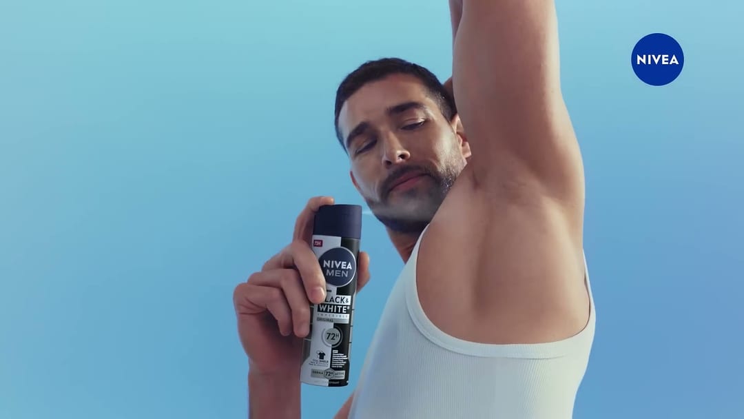 Get Noticed, Continuing skin-focus shot with the NIVEA mark held, visual hierarchy is clean.