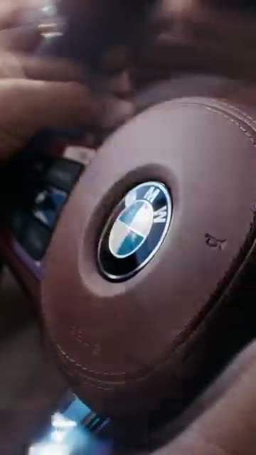 Beat the Skip, Steering-wheel BMW roundel close-up, brand_in_first_3s = yes, locked instantly.