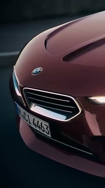 Brand Impact, Red BMW front quarter, kidney grille + roundel + plate visible. Brand stays anchored.